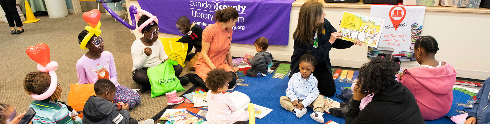 photo - Frst Lady , children, reading, holding a book