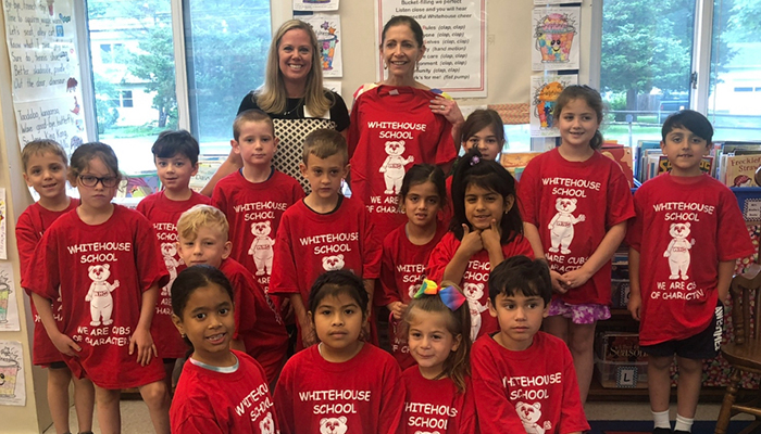 First Lady and group of children from Whitehouse School  dressed read TShirt