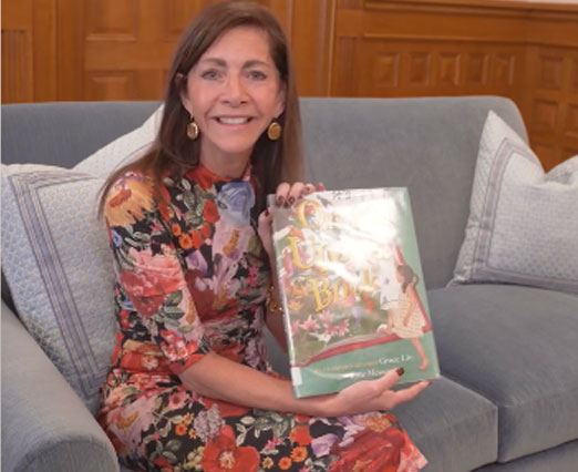 First Lady holding the Once Upon a Book