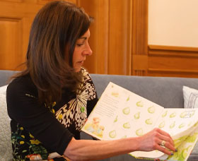 Photo of First Lady reading the book Bloom: An Ode to Spring