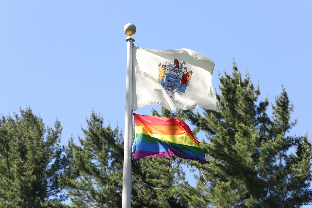 Photo contains: New Jersey State Flad and Pride Flag