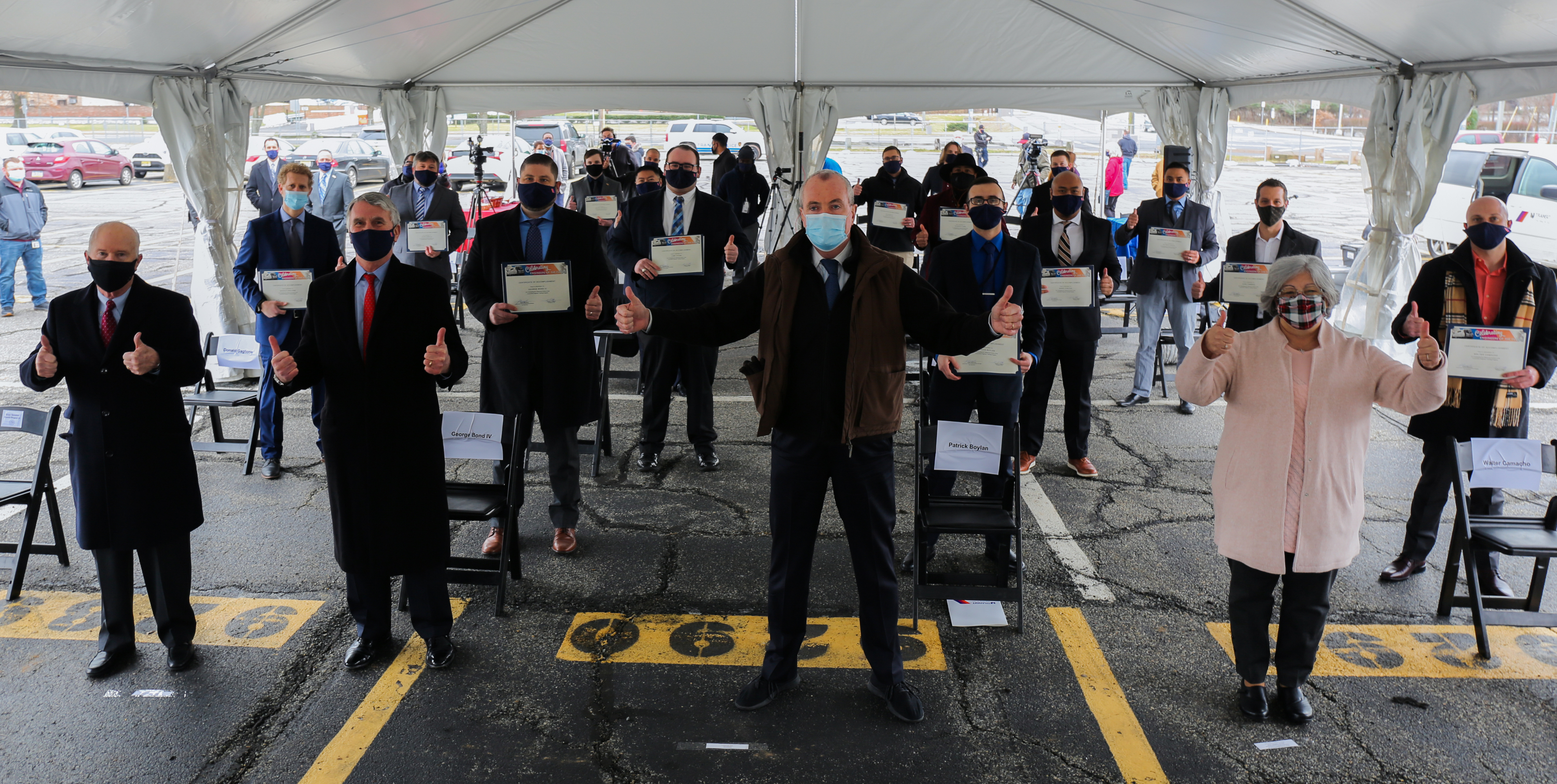 photo contains: Governor Phil Murphy, Department of Transportation Commissioner and NJ TRANSIT Board Chair Diane Gutierrez-Scaccetti and NJ TRANSIT President & CEO Kevin Corbett and The class of 17 engineer trainees 