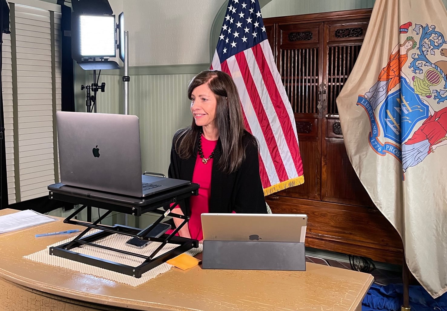 First Lady Tammy Murphy at desk using laptop