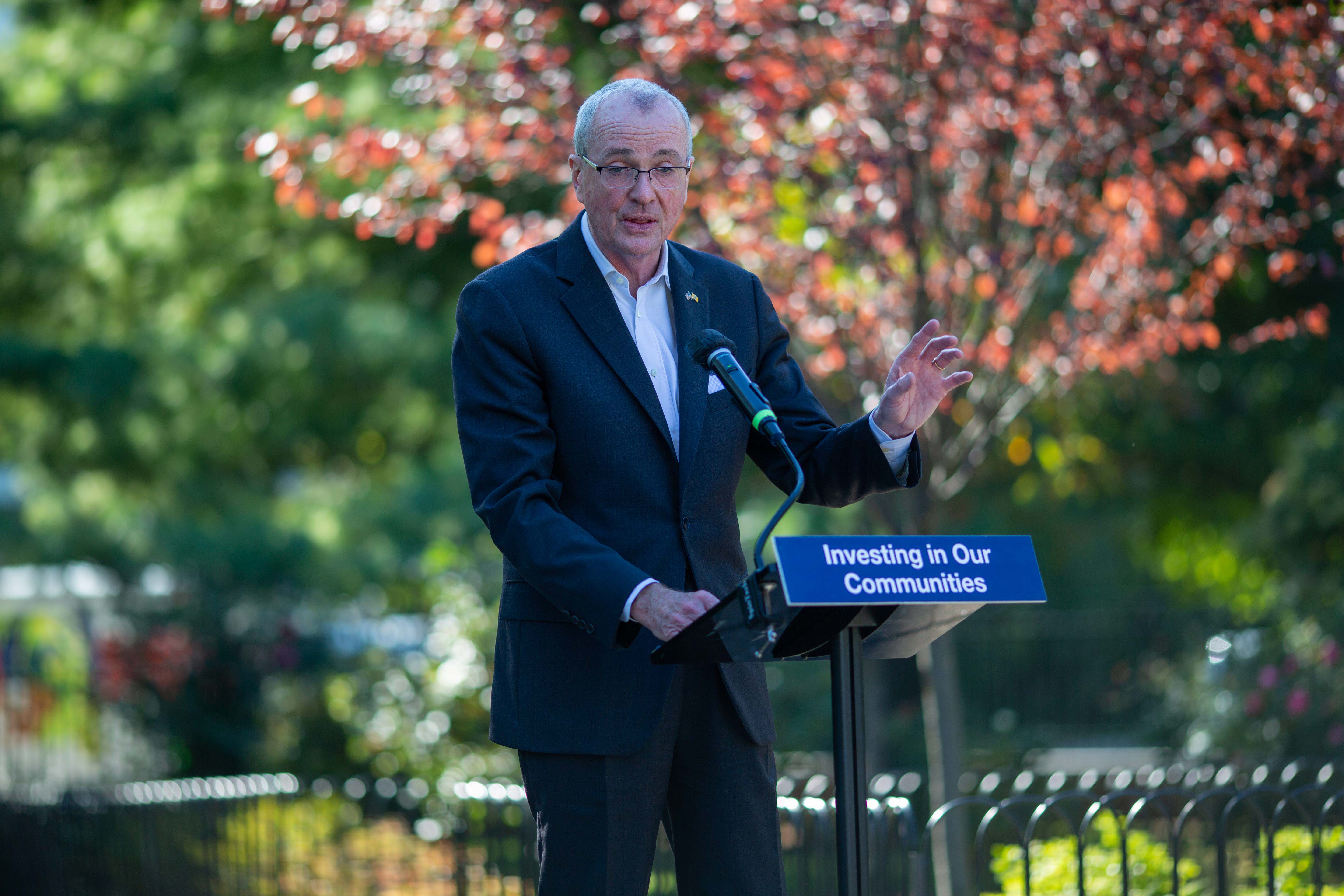 photo: Governor Murphy speaking, stanging, oudoor