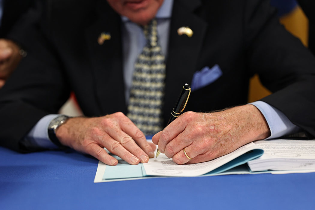 Photo of Governor Phil Murphy signing a document