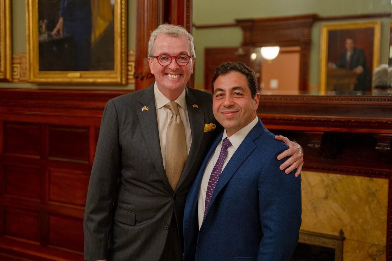 Photo: Governor Murphy stands with George Helmy in the office