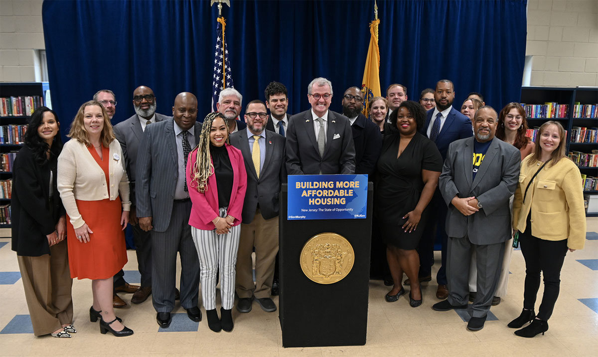 Photo: Governer Murphy at his podium with members of his team