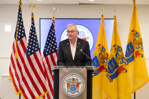Governor Murphy at the Podium with American and State flags