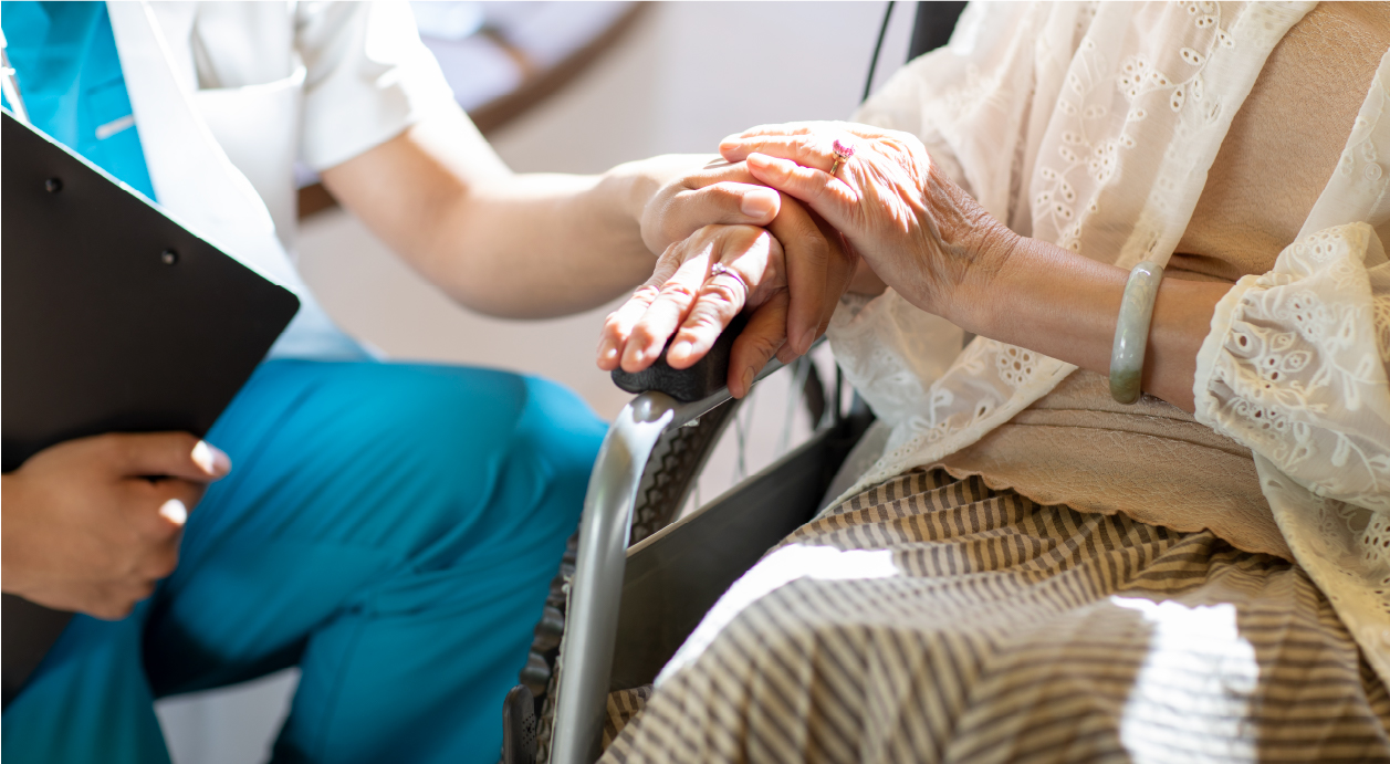 A medical professional embracing a patient.