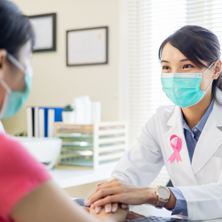 Medical Professional Holding Tablet