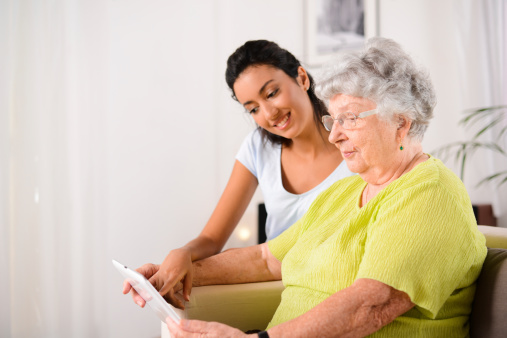 Woman helps another adult woman with application