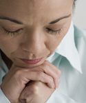 Woman is holding her hands together