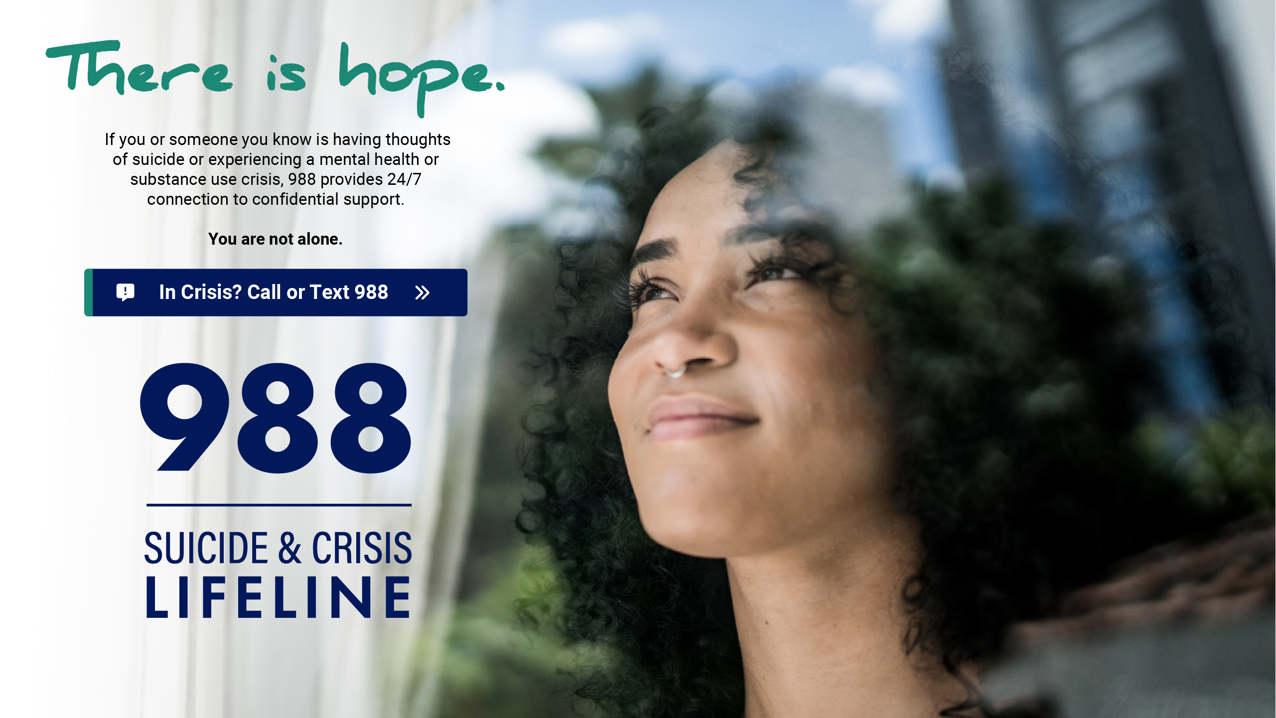 Woman is looking through the window