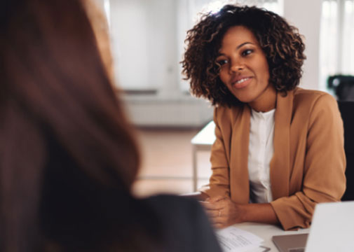 photo of employee talking to an employer