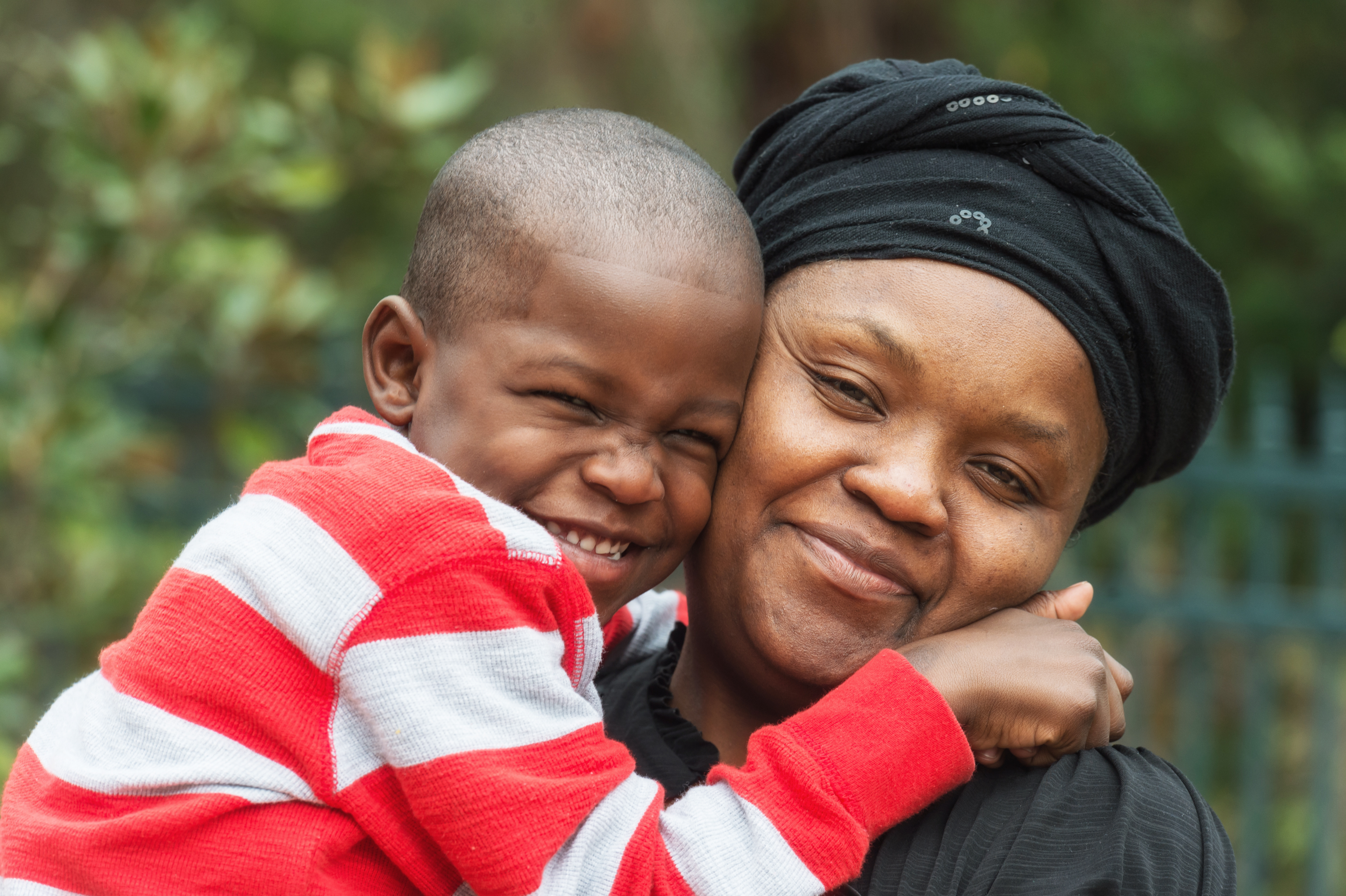 image: mother holding todler