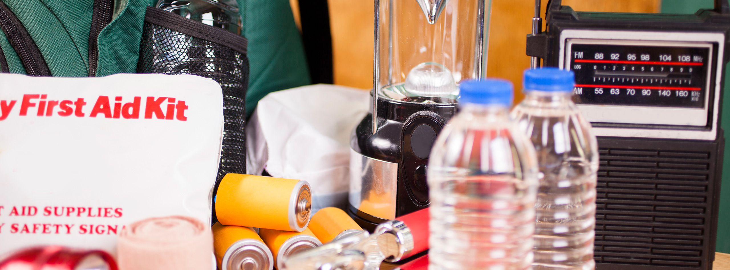 First Aid Kit, water, radio, batteries, flashlight