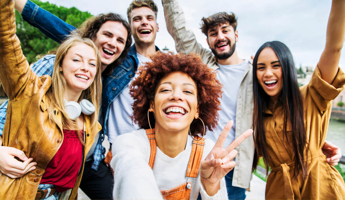 Group of people posing and smiling