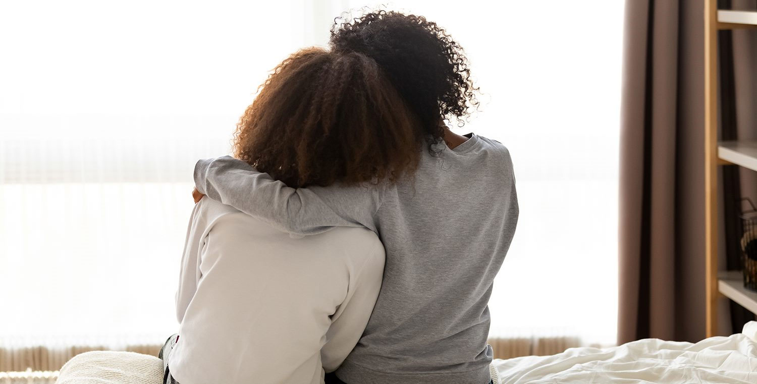 photo: couple sitting, holding each other