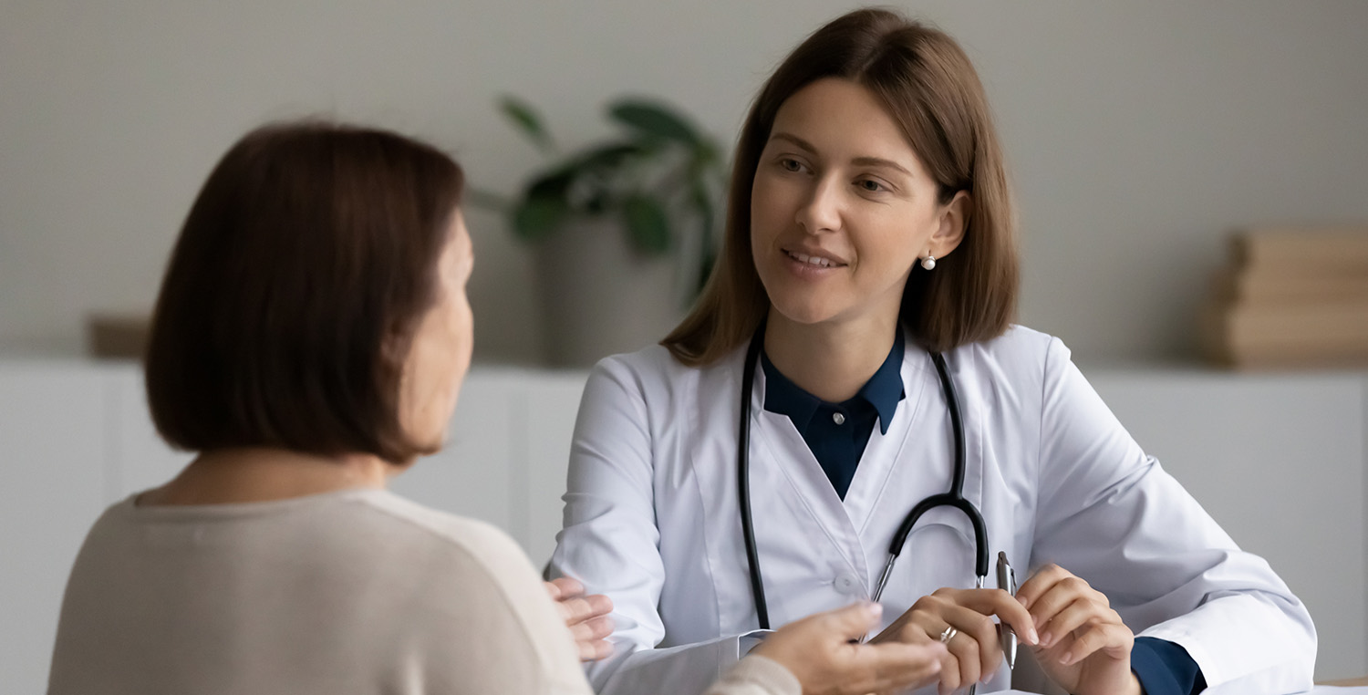 person meeting with a doctor in office