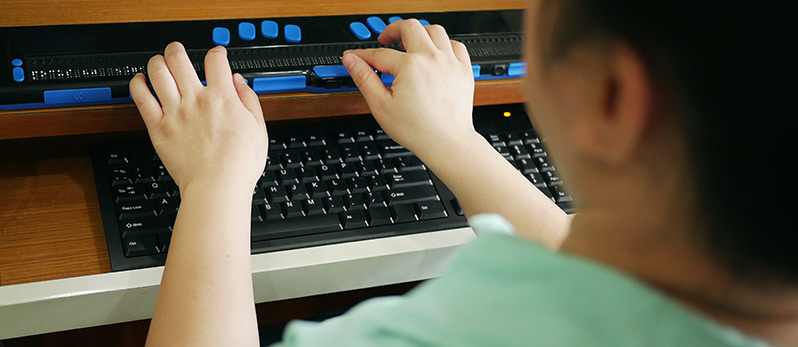 hands on a computer keyboard