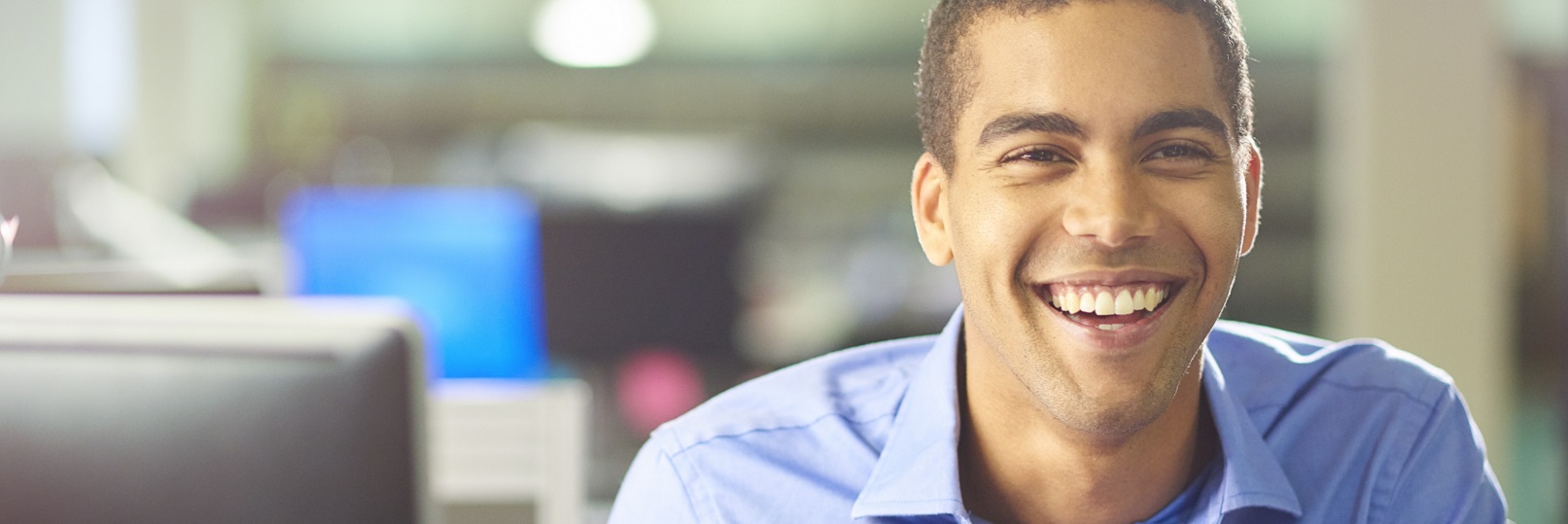 smiling intern working at a desk