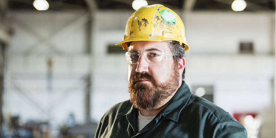 a construction worker looking thoughtful