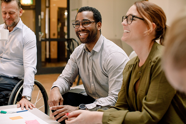 a diverse group of people working in an office