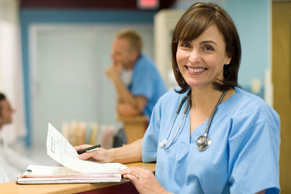 Female doctor reviews her patient's records