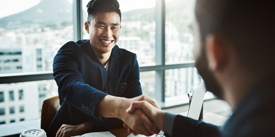 employee shaking hands with employer