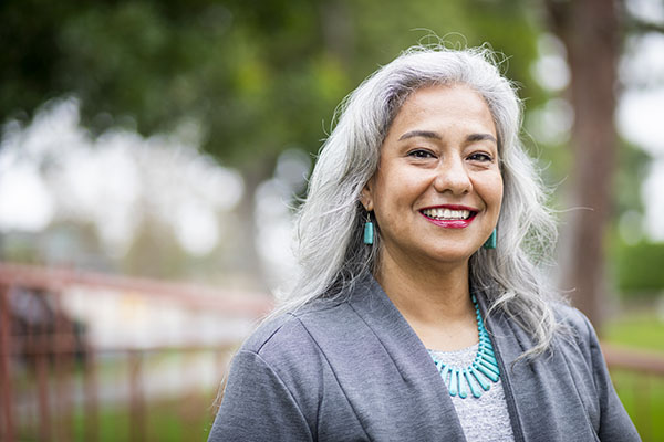 Elderly woman smiling outside