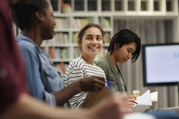 A diverse group of teens in a classroom