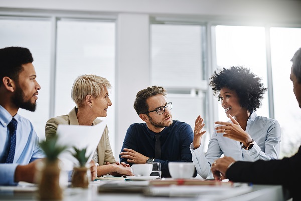 working professionals sitting around a table