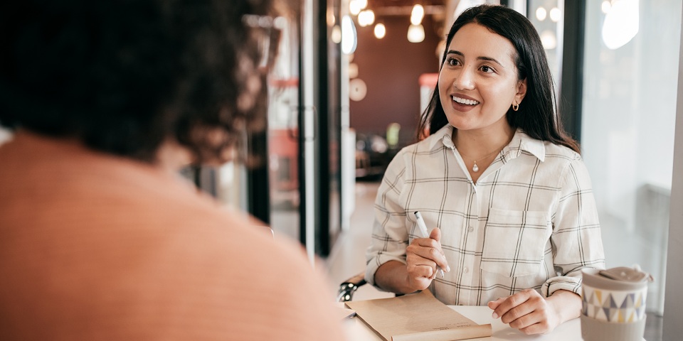 two people talking at an office