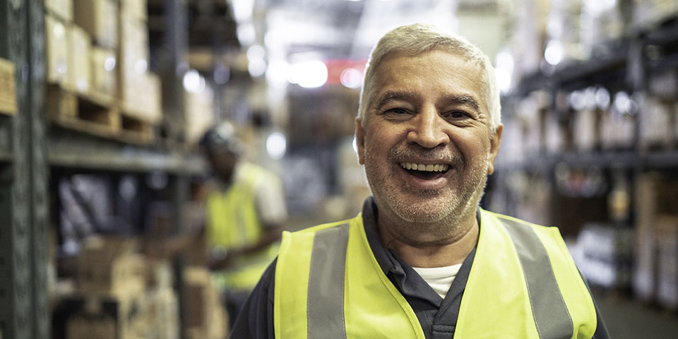 senior man working at a warehouse