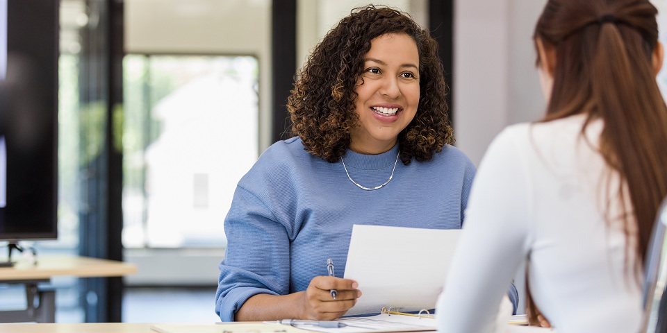 two people talking at a job fair
