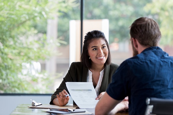 Business woman meeting with another man at table