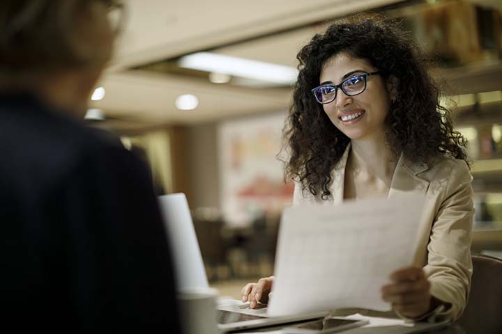 woman at a desk meeting with someone