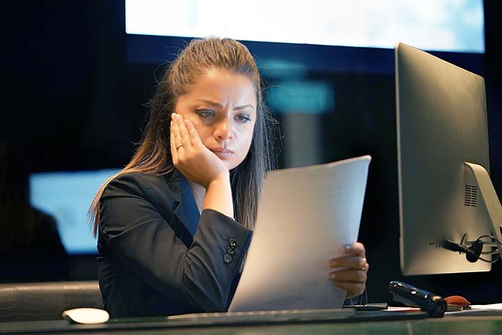 woman looking at documents in an office