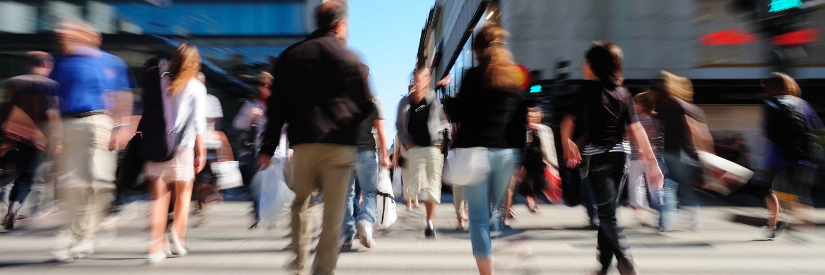 Busy commuters crossing the street