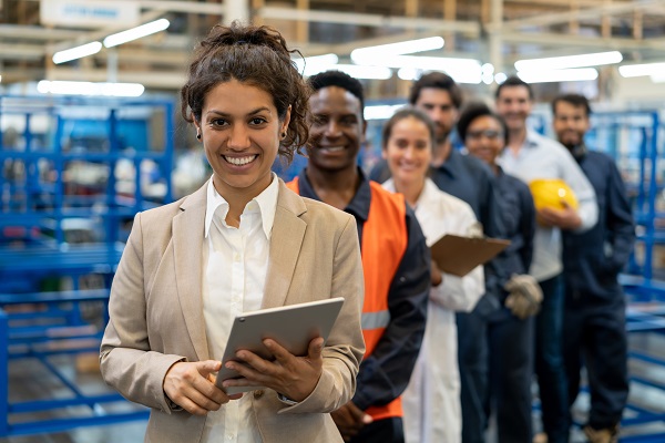 Workers in row smiling at camera