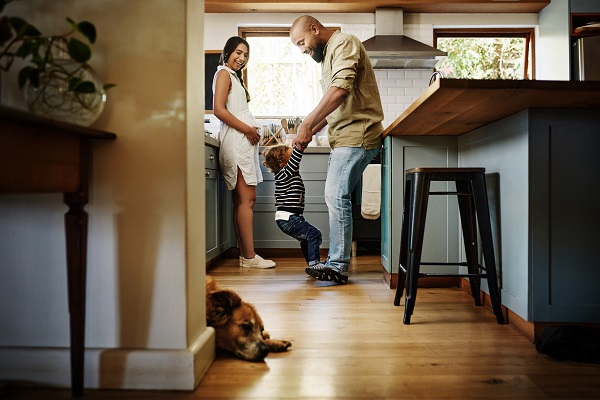 Shot of family playing together in the kitchen at home