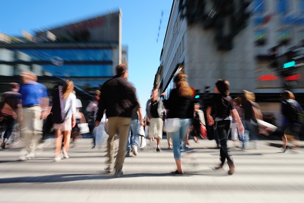 Busy commuters crossing the street