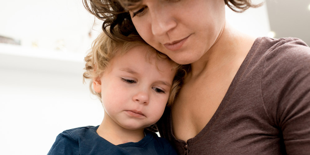 Mom holding child