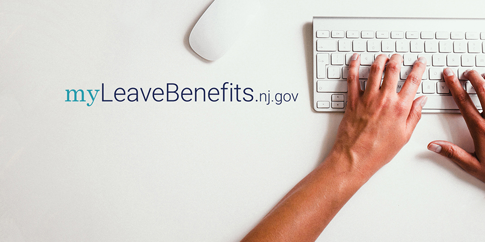 a woman's hands typing on a computer keyboard