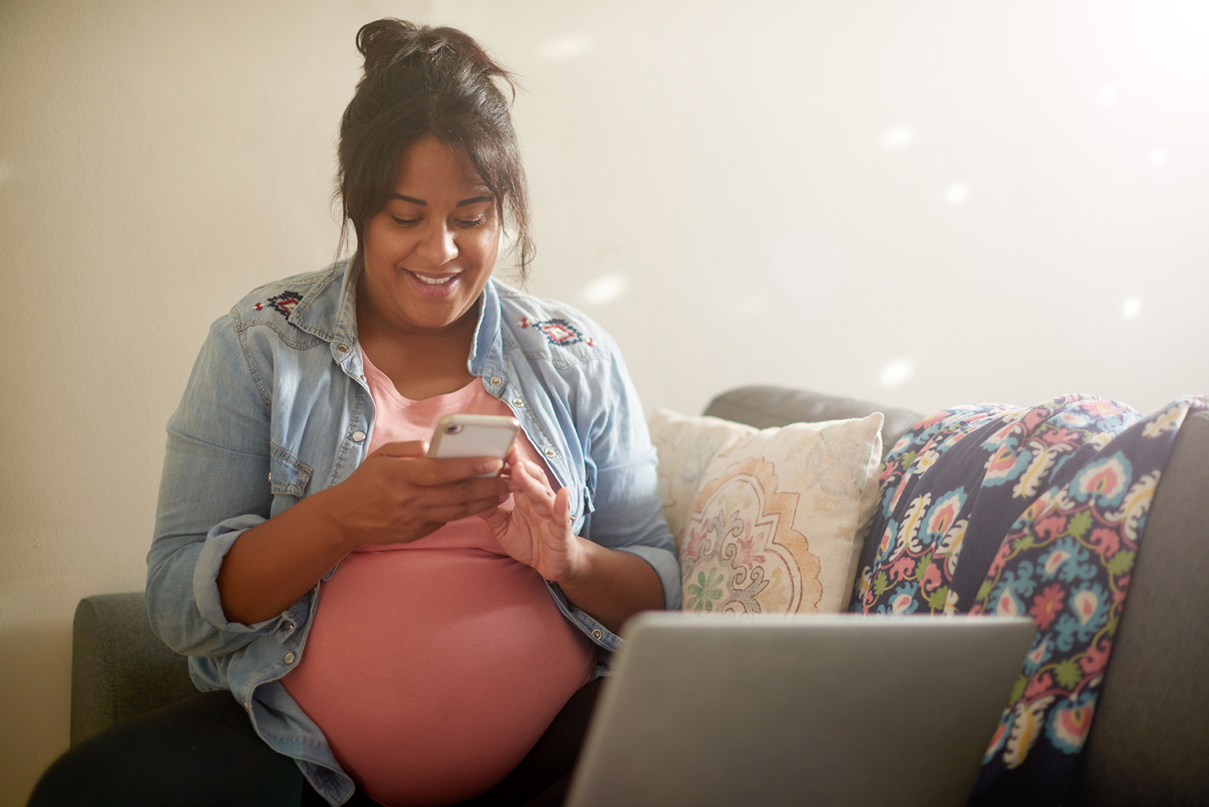 Pregnant woman using a smartphone