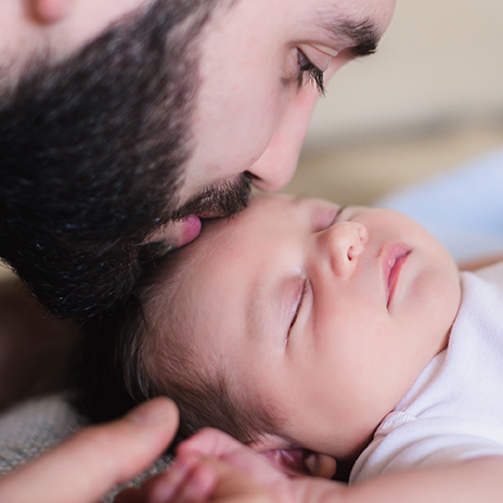 father holding baby