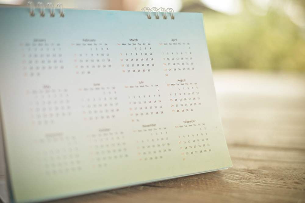 a softly lit still-life of a desk calendar