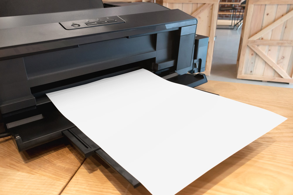 A printer with paper loaded in the tray
