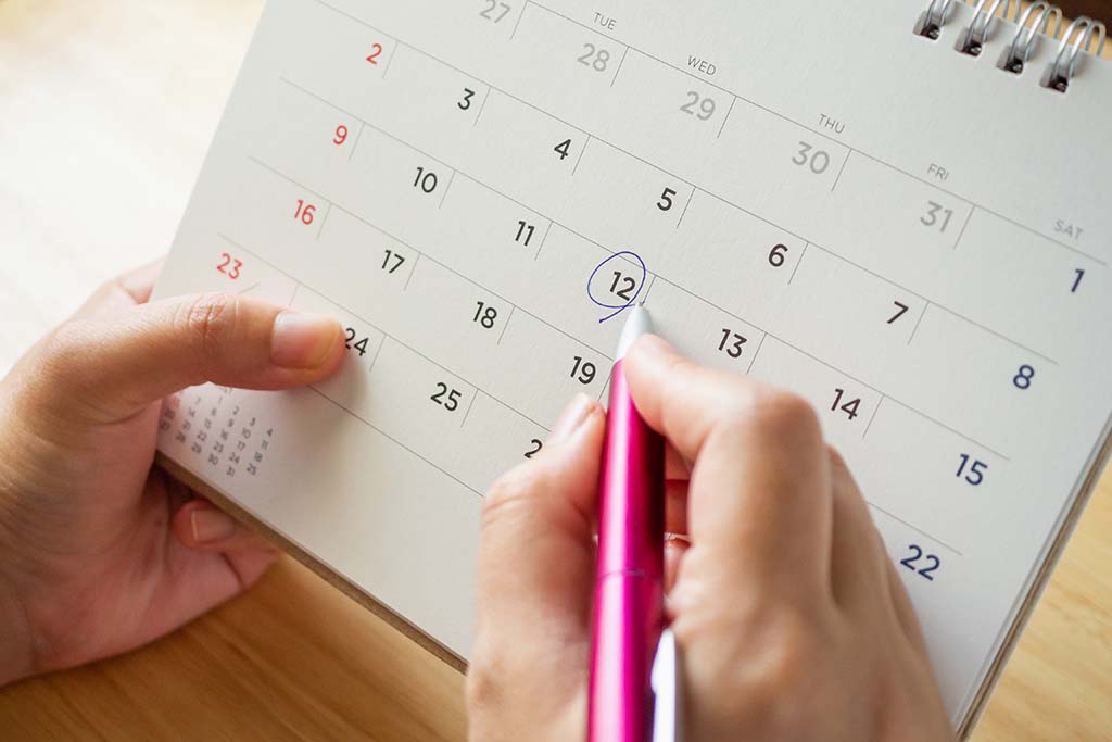 woman looking at a calendar