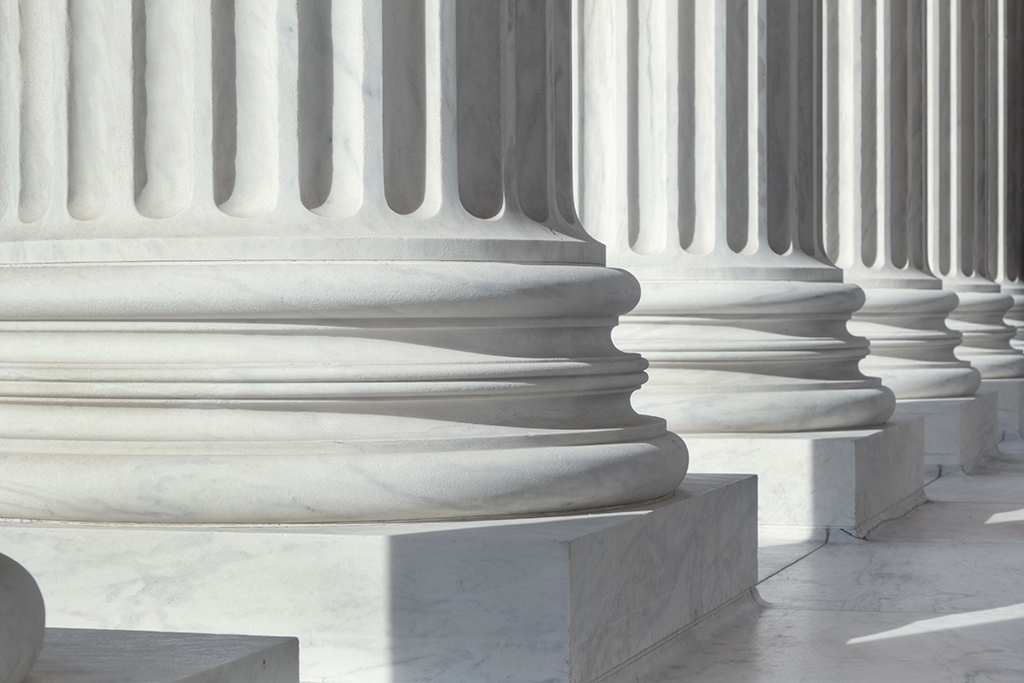 a closeup picture of the bottom of columns at a federal building in Washington DC